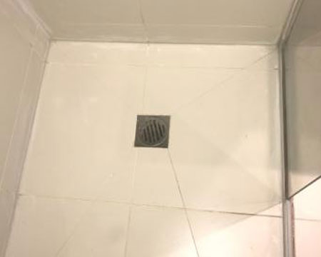 New caulking to freshen the shower .
