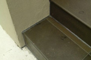 Caulking on an external paved pathway.