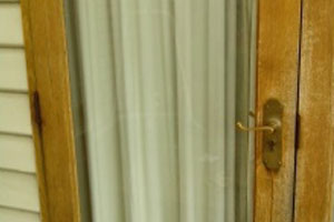 Glass panel replaced within timber door frame